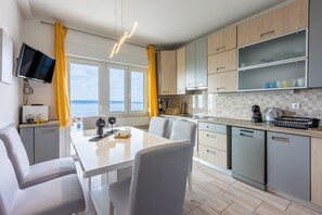 Fridge, stovetop, dishwasher, coffee/tea maker