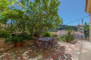 Outdoor dining - Mediterranean flat just 500 metres from the beach with a view of the Dubracina river (Crikvenica)