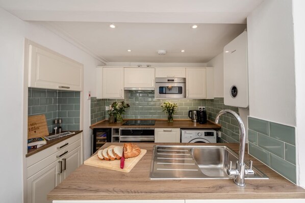 Microwave, oven, high chair, cookware/dishes/utensils