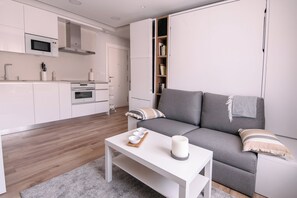 Appartement, 1 chambre, balcon, vue ville | Salle de séjour