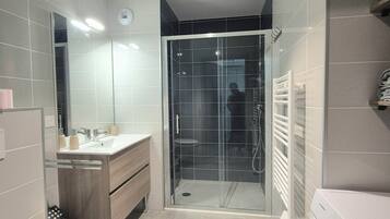 Shower, towels, toilet paper