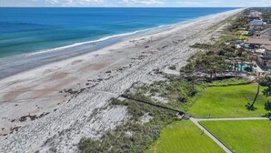 A coastal property with a beach, a walking path, and a pool area. - 604 Surf Villas Oceanfront Luxury Condo at Sawgrass Beach Club in Beautiful PVB! (Ponte Vedra Beach)