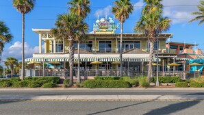 A building with a sign reading "Margaritaville" and a beachside location. - Emerald Beach Resort 2028 (Panama City Beach)