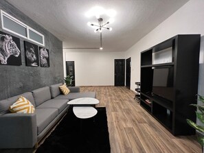 Apartment, 4 Bedrooms | Living area