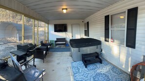A covered porch with a grill, seating, and a hot tub. - Springside Cottage in beautiful Eminence. Great outdoor space - NEW Hot tub! (Eminence)