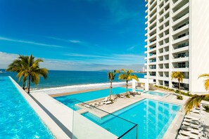 A heated pool - Luxury Condo 1BD beachfront, 8 pools at Harbor 171 1BD Condo for rent in North H (Puerto Vallarta)