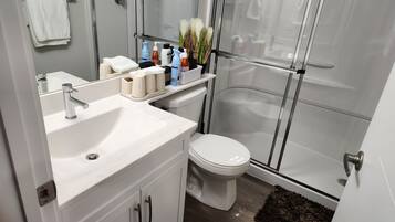 Shower, hair dryer, towels, soap