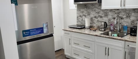 Fridge, microwave, stovetop, coffee/tea maker