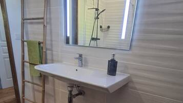 Shower, hair dryer, towels, soap