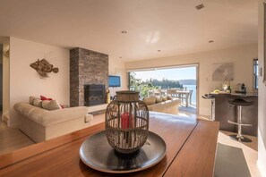 TV, books - The Lake House | Stunning Views + Private Jetty (Okere Falls)