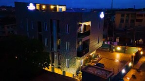 A multi-story building with balconies and a rooftop area. - The Panache Luxury Apartment (Lagos)