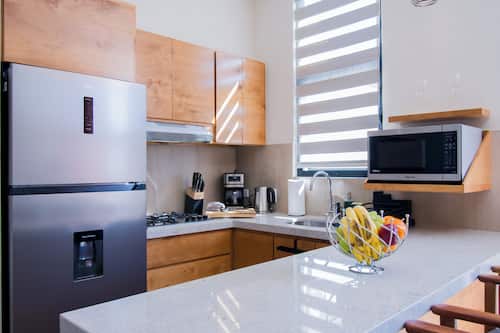Appartamento Deluxe, 1 camera da letto | Cucina privata | Frigorifero con congelatore, microonde, piano cottura, frullatore