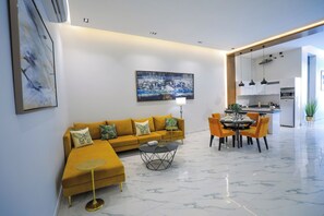 Deluxe Villa, Patio, Pool View | Living area