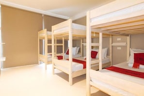 A room with bunk beds arranged in a row. - RedDoorz @ Laiya Vivo Hotel Batangas (San Juan)
