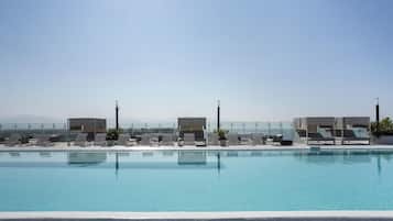 2 outdoor pools, open 9:00 AM to 10:00 PM, pool loungers
