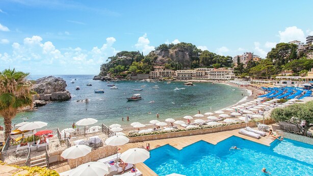 A coastal resort with a swimming pool, beach, and boats in the water. - 2 bedroom gorgeous apartment in Trappitello (Trappitello)