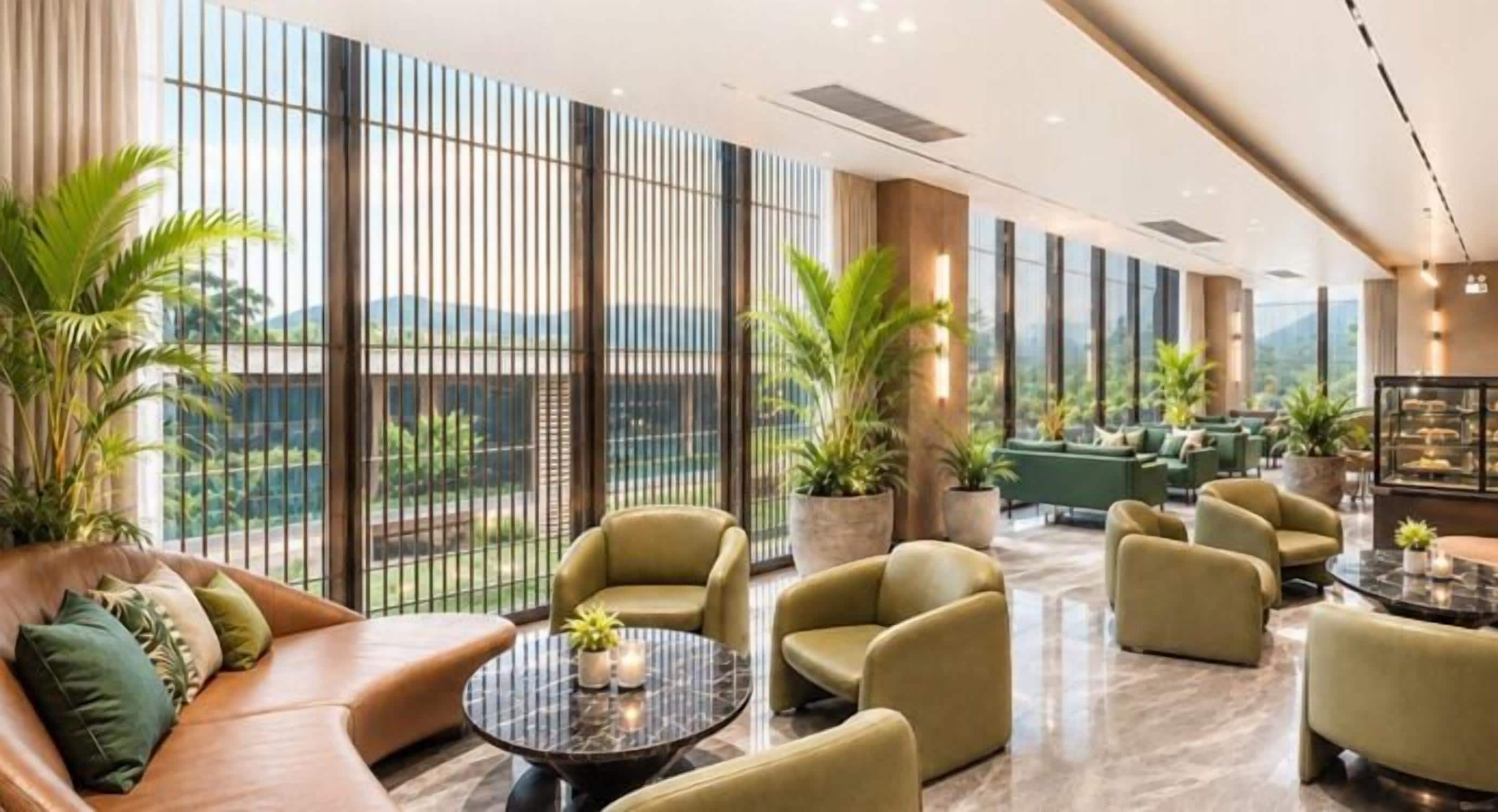A spacious lounge area with seating, a coffee table, and large windows offering a view of greenery and mountains.