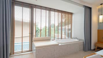 Deluxe Room, 1 King Bed, Pool Access | In-room safe, iron/ironing board, free cots/infant beds, bed sheets