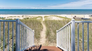 A beach pathway leading to the ocean with a clear view of the sea. - B30: Pet friendly stay on Lake Michigan | Relax & Unwind (Spring Lake)