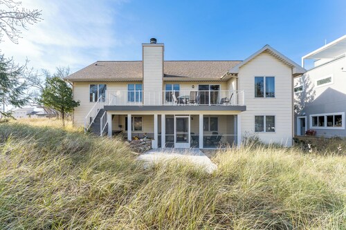 Experience lakeside luxury at Sunset Cove, a spacious 5-bedroom home