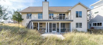 Experience lakeside luxury at Sunset Cove, a spacious 5-bedroom home