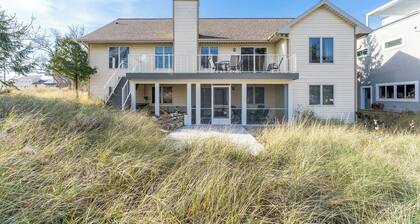 Experience lakeside luxury at Sunset Cove, a spacious 5-bedroom home