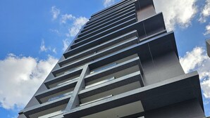 A modern building with a prominent sign reading "BARRA CONCEPT". - Cozy Studio w Balcony & Pool in Carnival's Heart - SSA009 (Salvador - BA)