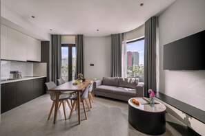 Two-Bedroom Apartment Balcony Ocean View | Living area | 44-inch Smart TV with cable channels - Nami Boutique Hotel & Apartment (Da Nang)