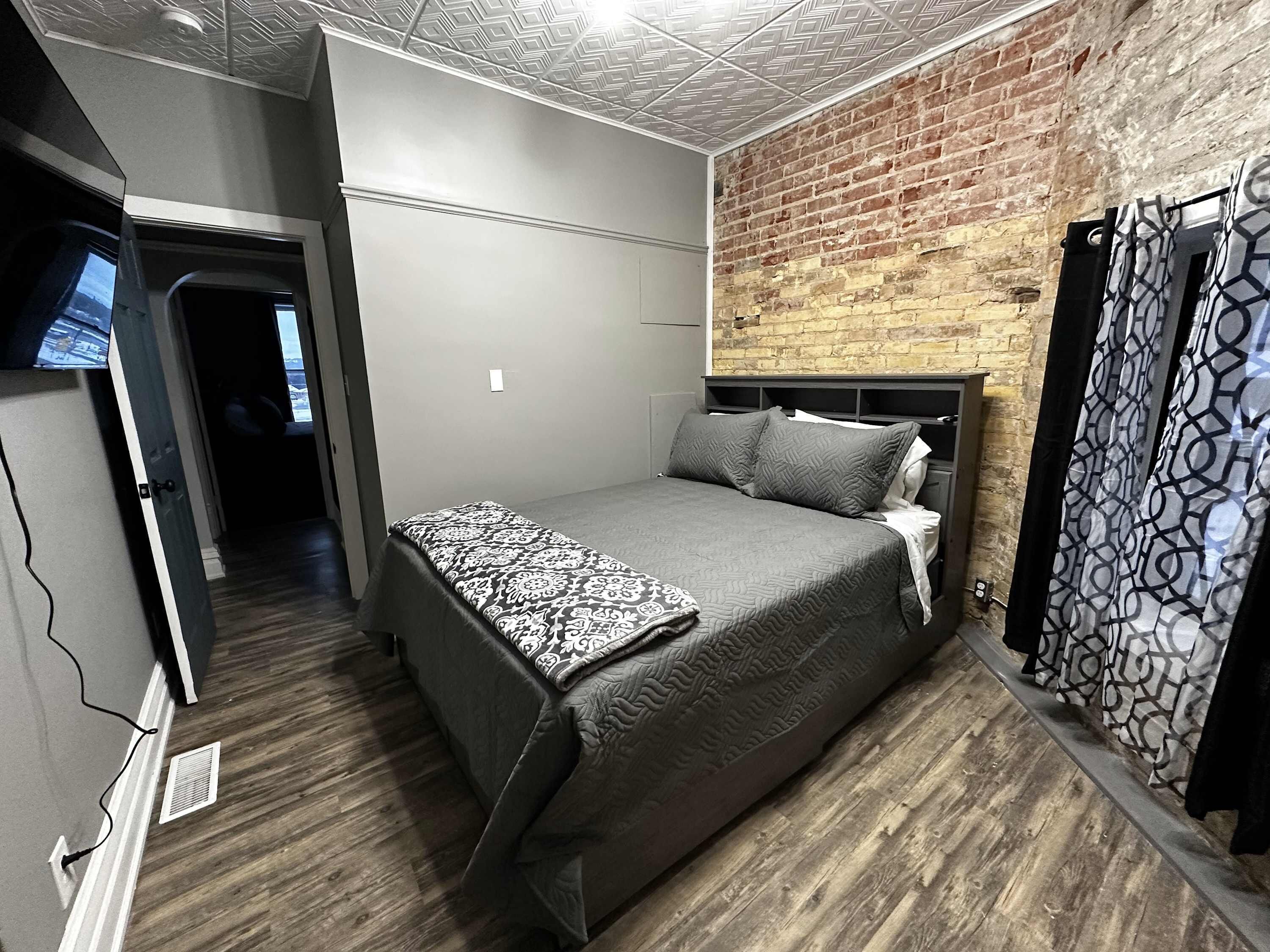 Queen master with full bathroom and attached to bunk bed room, smart TV