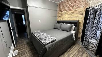 Queen master with full bathroom and attached to bunk bed room, smart TV