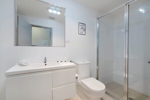 Shower, hair dryer, towels, shampoo