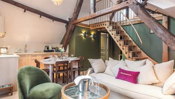 MATISSE - Two-Bedroom Superior Duplex Apartment | Living area | 50-inch Smart TV with digital channels