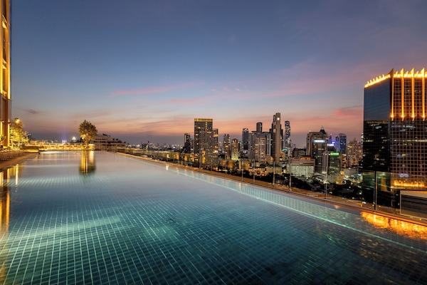 Outdoor pool, open 6:00 AM to 10:00 PM, pool umbrellas, pool loungers