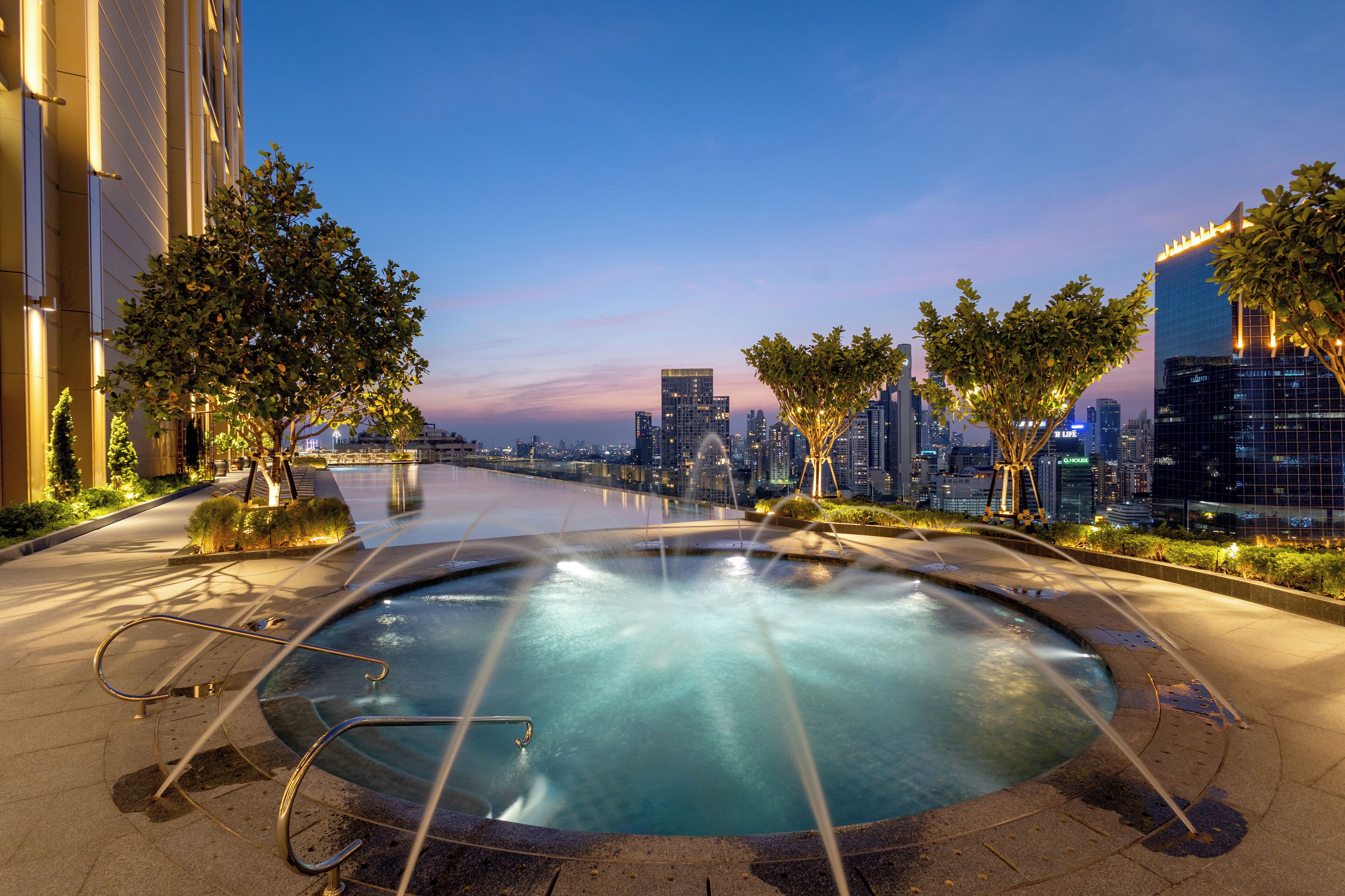 Outdoor pool, open 6:00 AM to 10:00 PM, pool umbrellas, sun loungers