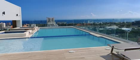 Outdoor pool, pool umbrellas, pool loungers