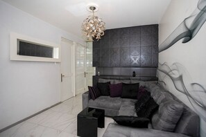 Apartamento conforto | Área de estar | TV