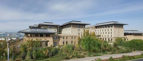 A modern building with a sign reading "FOUR POINTS".