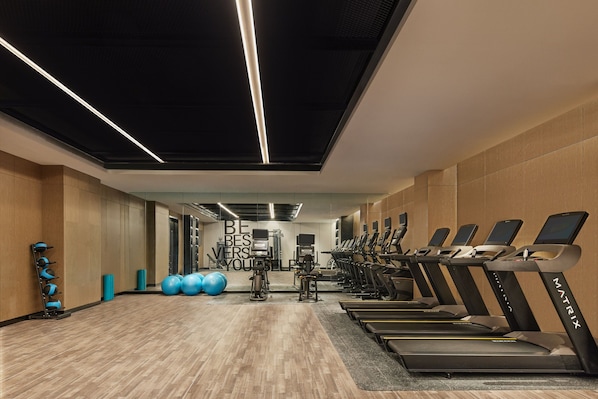 A gym with treadmills, exercise balls, and weight machines. - Four Points by Sheraton Dunhuang (Jiuquan)