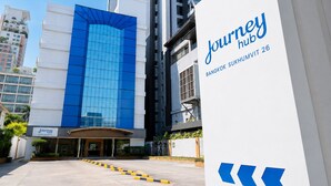 A modern building with a prominent blue glass facade and a sign for 'Journey Hub Bangkok Sukhumvit 26' indicating a hotel or business center. - Journeyhub Sukhumvit 26 Bangkok (Bangkok)