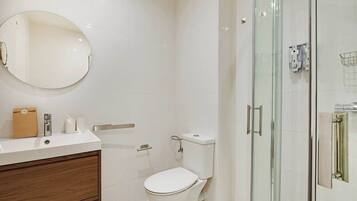 Shower, hair dryer, towels, shampoo