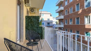 Deluxe Quadruple Room, City View | Terrace/patio