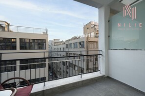 Estudio Premium, balcón, vista a la ciudad | Balcón