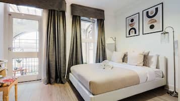 1 bedroom, desk, iron/ironing board, travel crib