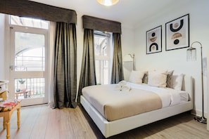 1 bedroom, desk, iron/ironing board, travel crib