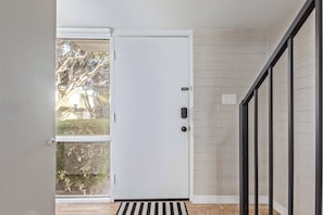 A white door with a black handle, a glass door, and a black metal railing. - NEW|Heatherbrae 8|Old Town|Htd. Pool|Mtn View (Scottsdale)