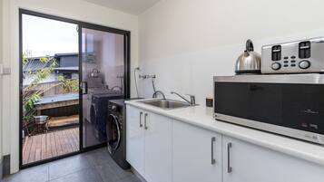 Fridge, microwave, toaster, cookware/dishes/utensils