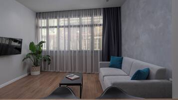 Hebrard Suite | Living area | 45-inch flat-screen TV with cable channels