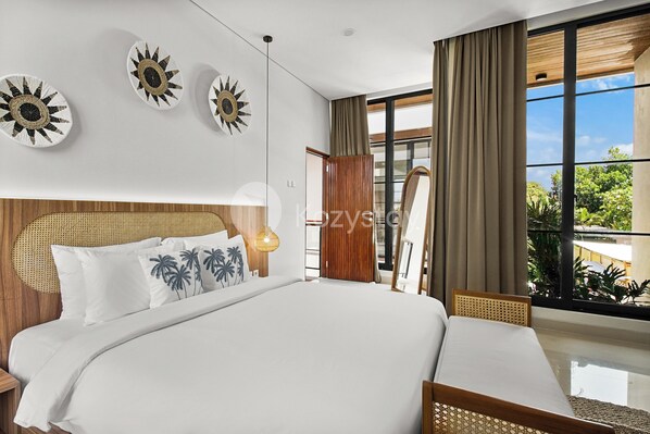 A modern bedroom with a large bed, a wooden headboard, and a view of the outdoors.