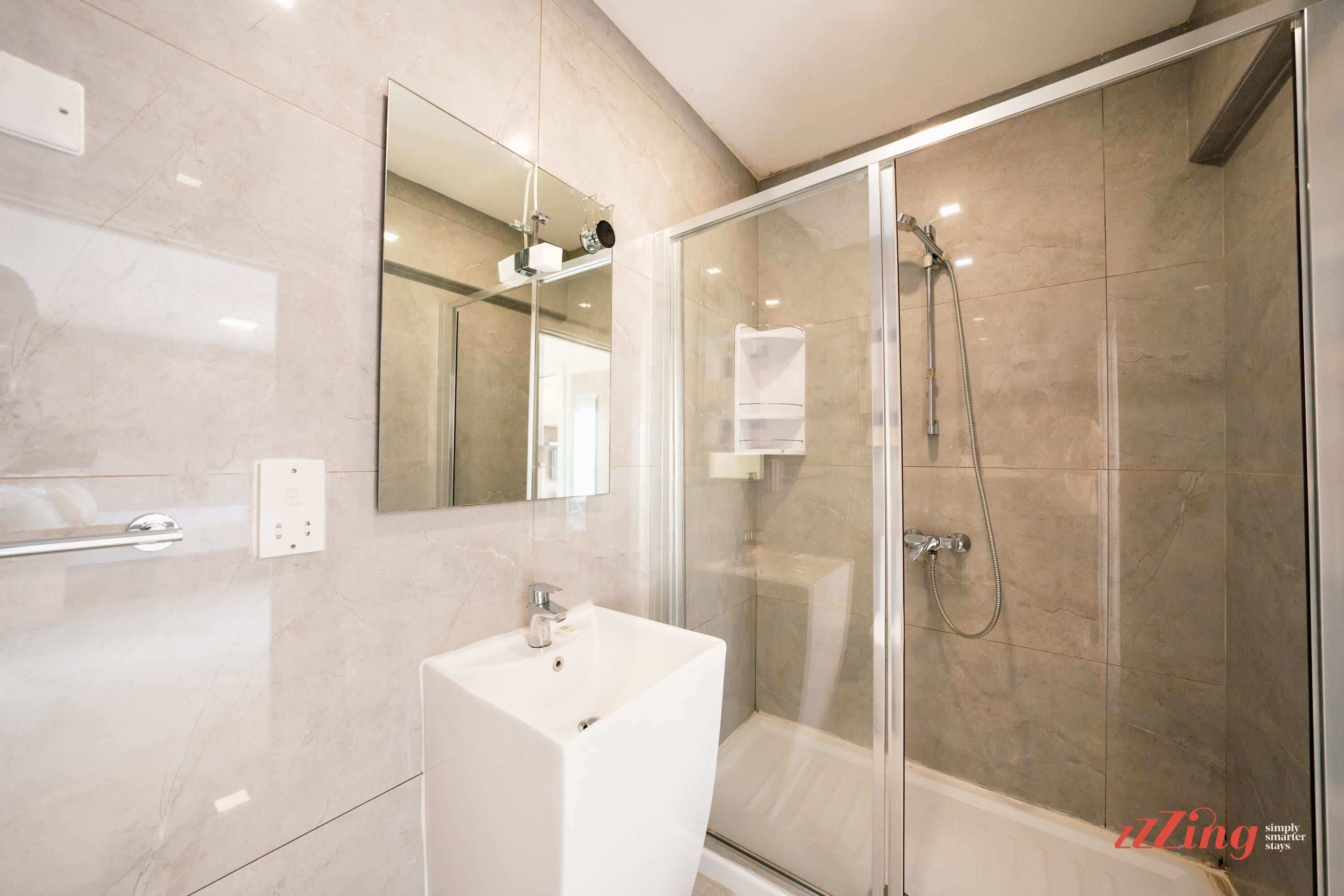 Shower, hair dryer, towels, shampoo