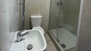 Basic Single Room, City View | Bathroom | Shower, free toiletries, towels, soap